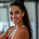 Maria Gomez celebrating a fitness milestone.